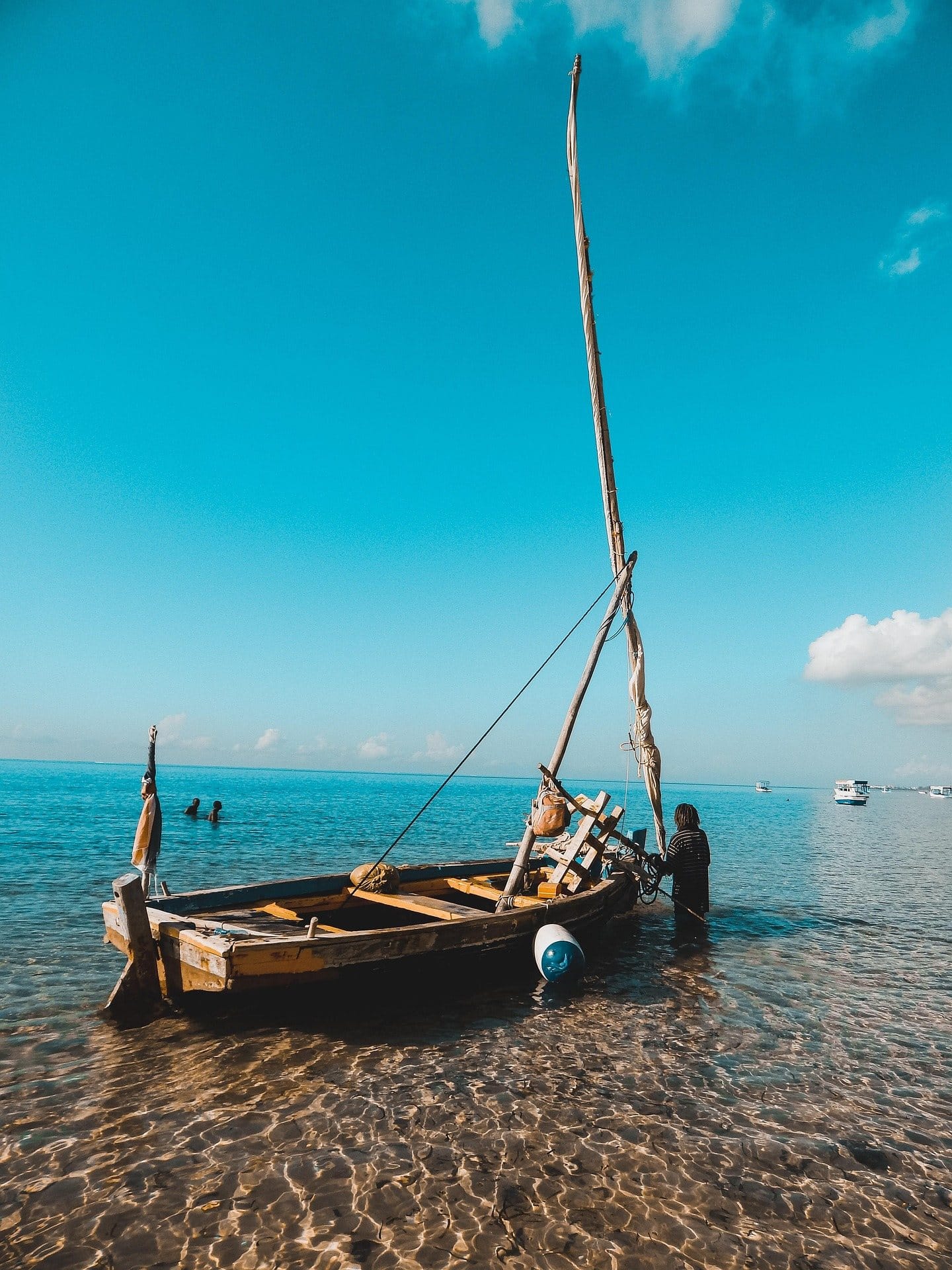 Traditional wooden dhow boat sailing near Mombasa coast