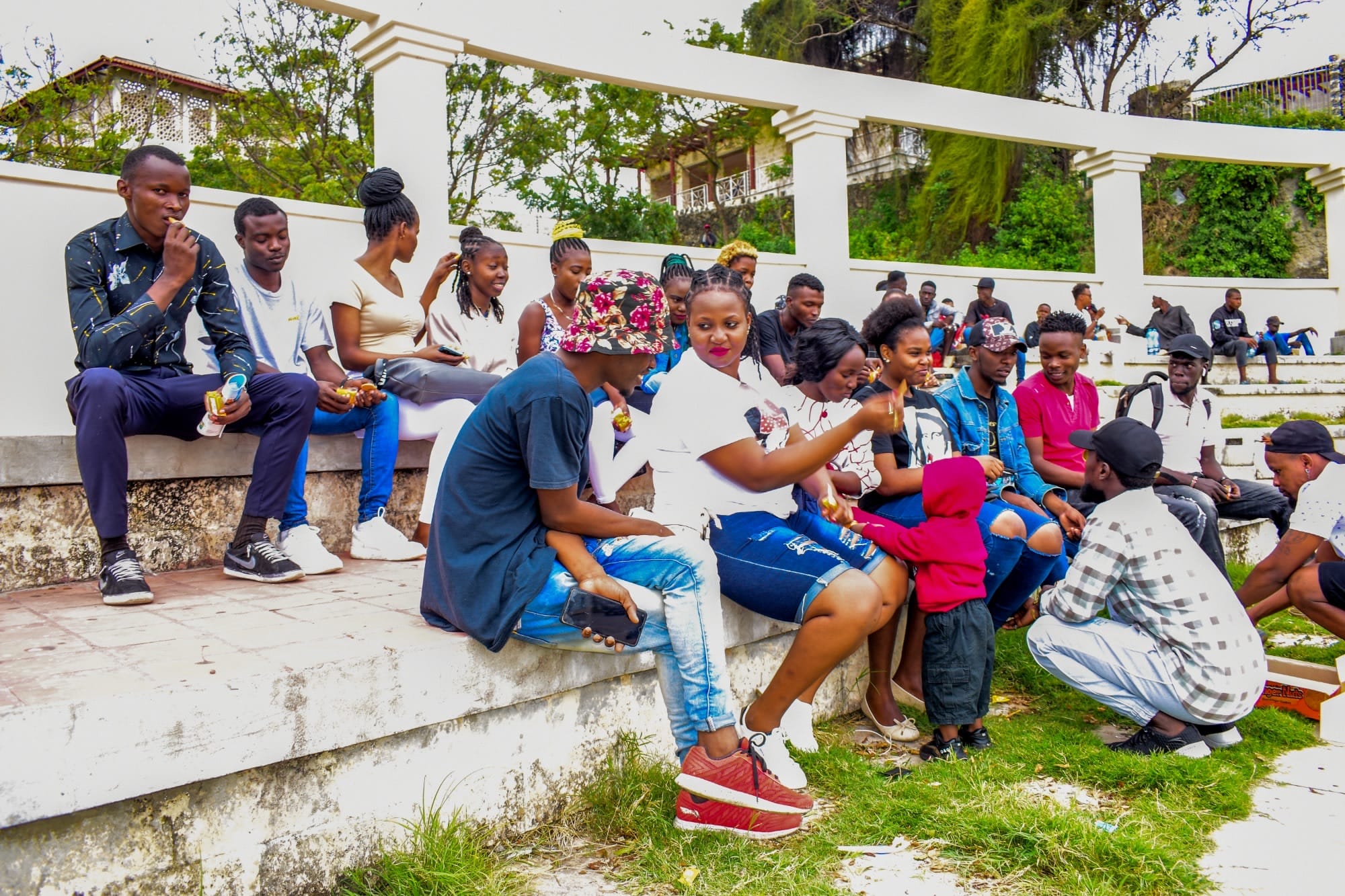 Group outdoor retreat activity on beachfront lawn
