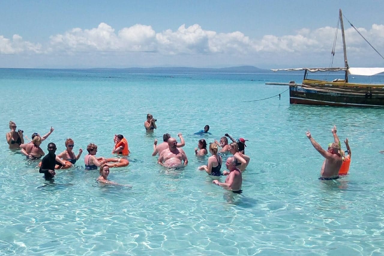Snorkellers exploring colorful coral reefs at Kisite park